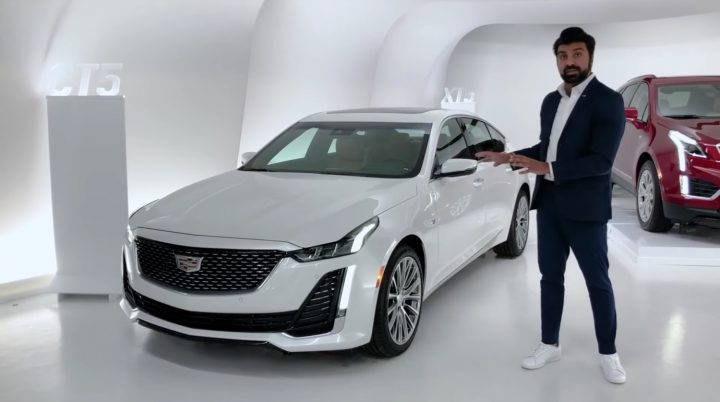 A GM employee giving a Cadillac Live walkaround.