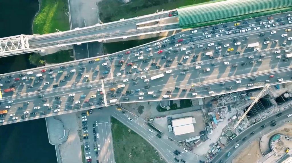 An overhead view of congested highway traffic.