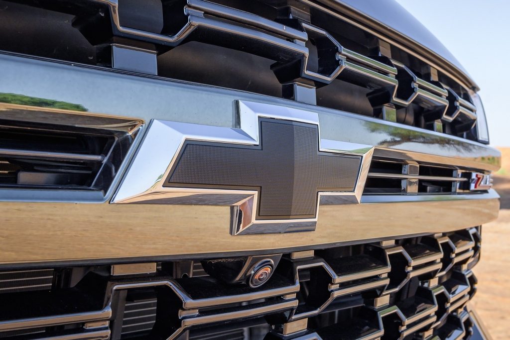 The Chevy logo on a Tahoe grille.