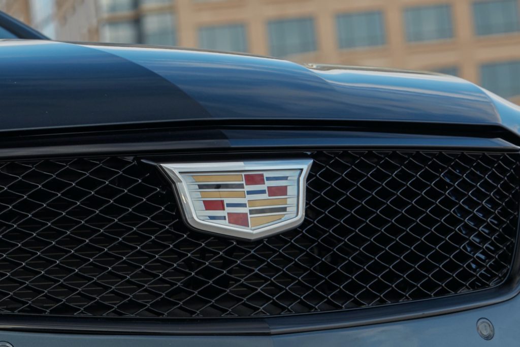The Cadillac logo on the grille of the 2022 Cadillac CT4. 