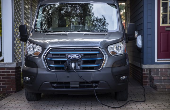 The front end of the all-electric Ford E-Transit commercial van.