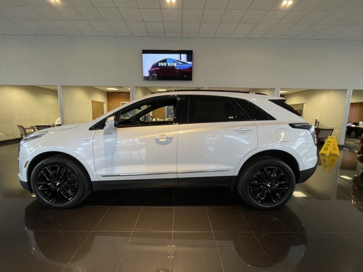 Side view of Cadillac XT5 Sport. Cadillac XT5 deals in March 2025 include up to $2,500 off.