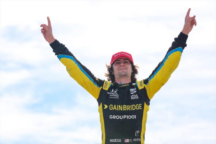 Photo of Colton Herta celebrating after winning the IndyCar race at Laguna Seca in 2021. Herta isn't sure he'd drive for the Cadillac F1 team if given the chance. 