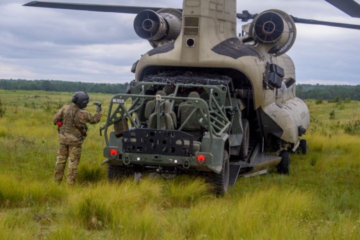 The GM ISV is loaded into a helicopter.