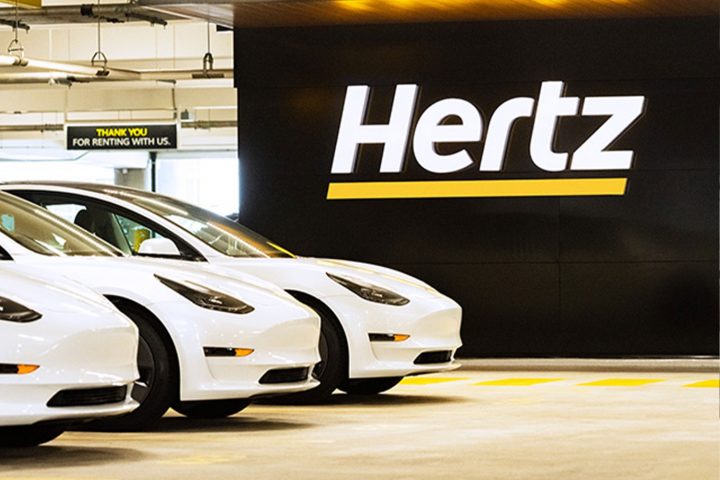 A Hertz rental lot filled with Teslas.