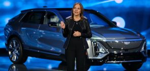 Mary Barra in front of a Cadillac Lyriq EV.