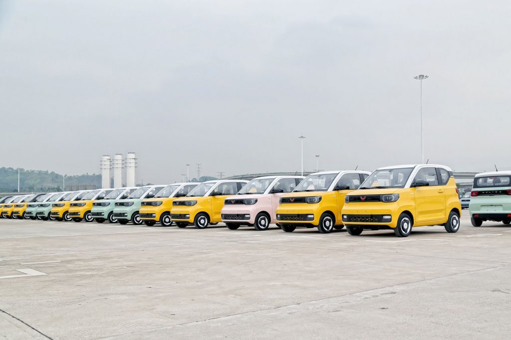 A group of Wuling MINI EV units on a factory parking lot.