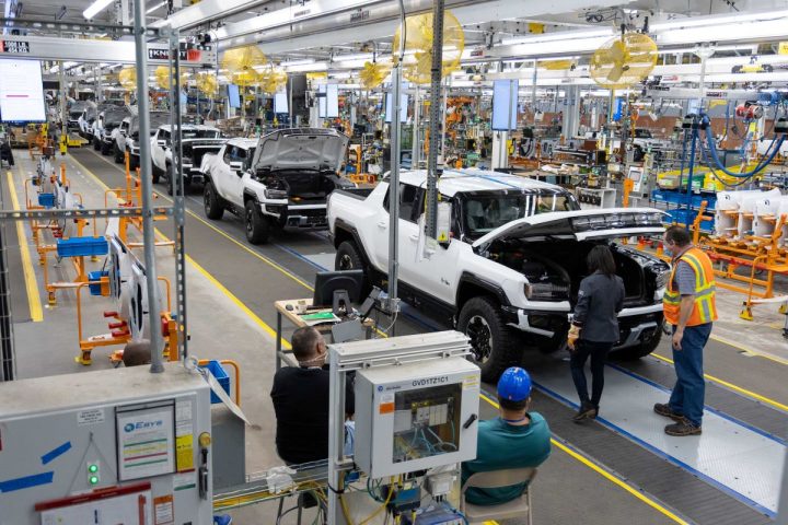 Photo of GMC Hummer EV units rolling down assembly line.