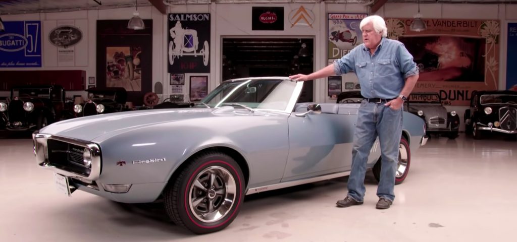 Jay Leno with a 1968 Pontiac Firebird Sprint.