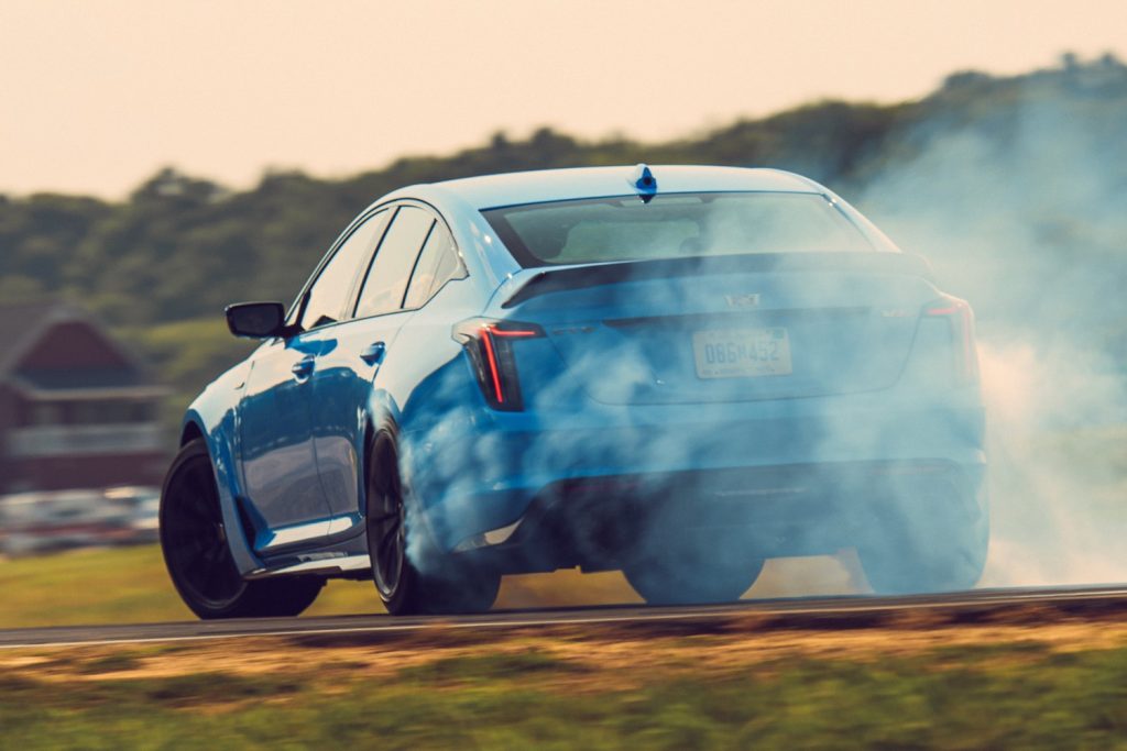 The Cadillac CT5-V Blackwing slides on the track in a cloud of tire smoke.