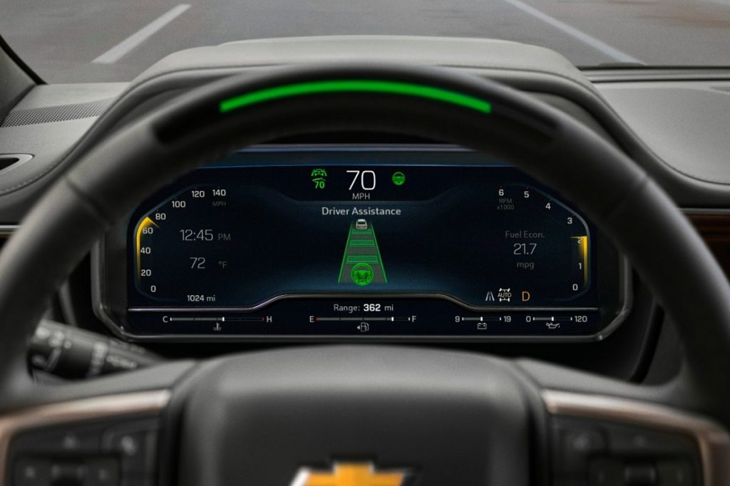 The green LED on the top of a 2023 Chevy Suburban steering wheel showing Super Cruise is active.