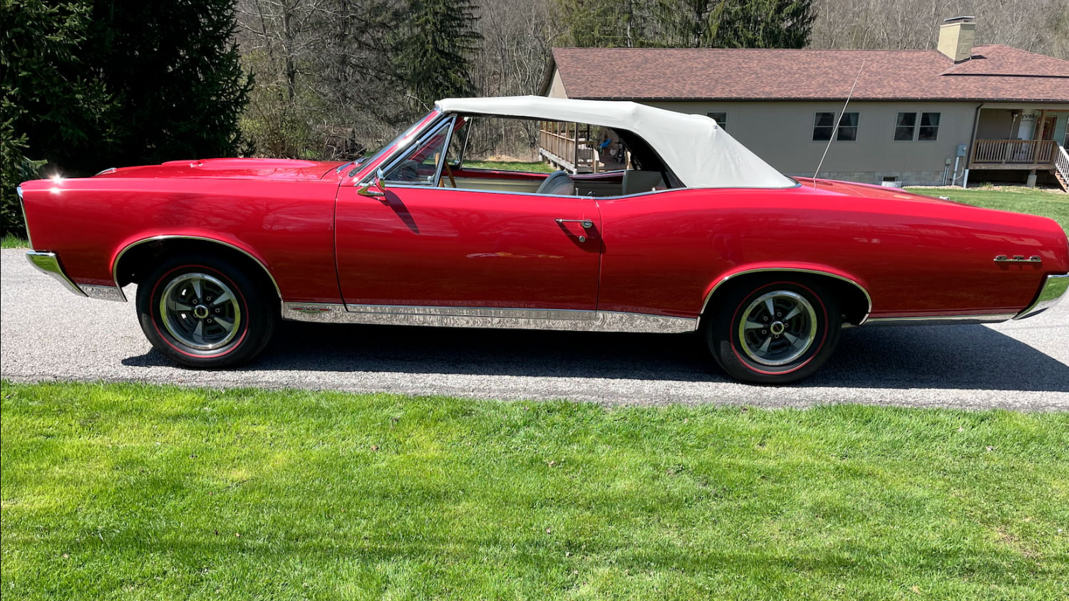 https://gmauthority.com/blog/wp-content/uploads/2022/07/1967-Pontiac-GTO-Ram-Air-Convertible-exterior-008-Mecum-Auctions-Regimental-Red-driver-profile-top-up.jpg