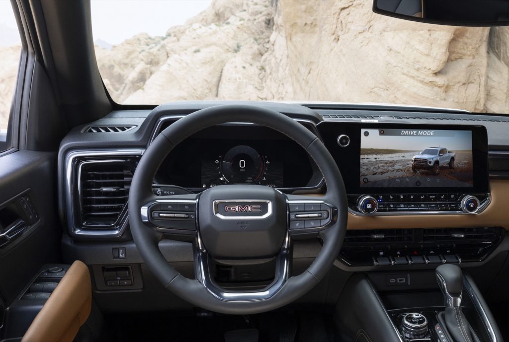 A photo of the 2023 GMC Canyon AT4 interior with 8-inch digital gauge cluster.