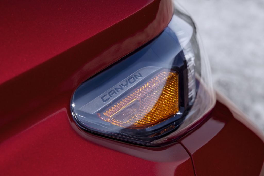 A Canyon logo inside the headlight of the 2023 GMC Canyon.