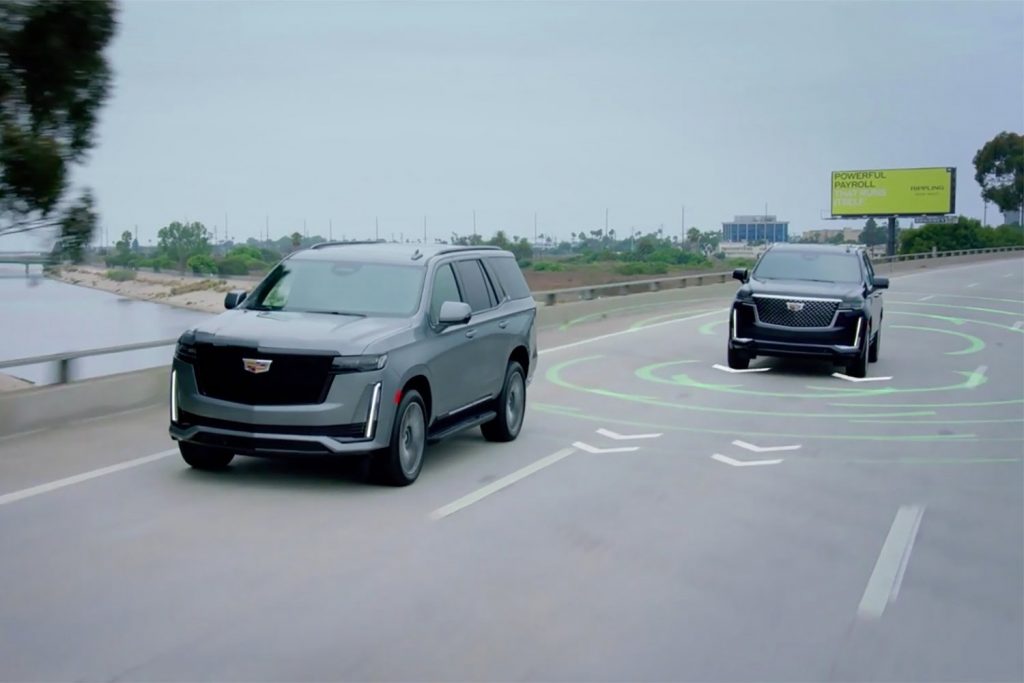 Photo of two Escalade models developing technology for self-driving vehicles.