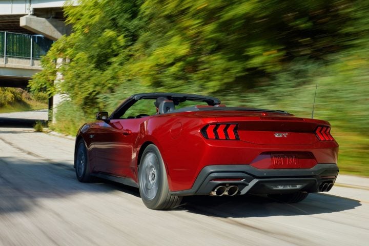 Redesigned 2024 Ford Mustang Unveiled As Chevy Camaro Rival   2024 Ford Mustang GT Convertible Press Photo Exterior 001 Rear Three Quarters 720x480 