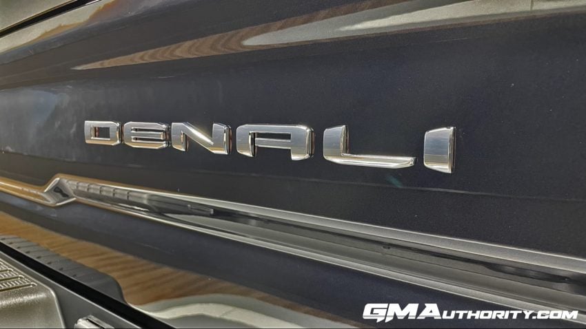 GMC Adopts New Y Trim Level Strategy Exclusive   2024 GMC Sierra 2500 HD Denali Ultimate Titanium Rush Metallic G6M Reveal Photos Exterior 027 Denali Logo Badge On Tailgate 850x478 