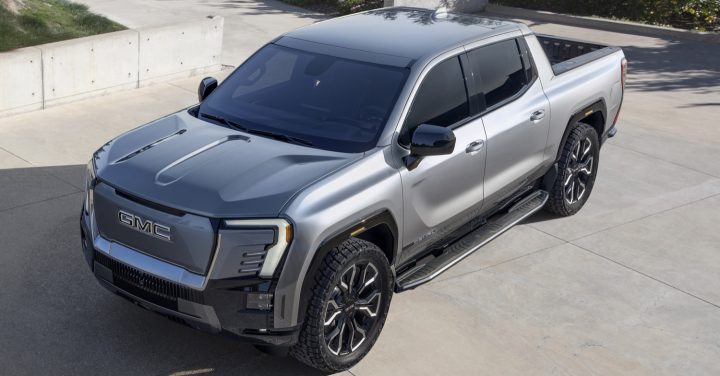 Side front three quarters view of the 2024 GMC Sierra EV. 