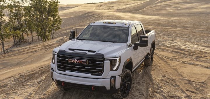 GMC Brand Drops In Consumer Reports Reliability Rankings   2024 GMC Sierra HD AT4 Press Photos Exterior 005 Front Three Quarters 720x340 