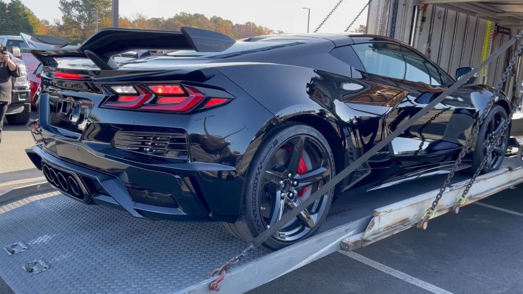 Rear three quarters view of the 2023 Chevy Corvette Z06 in Carbon Flash Metallic.