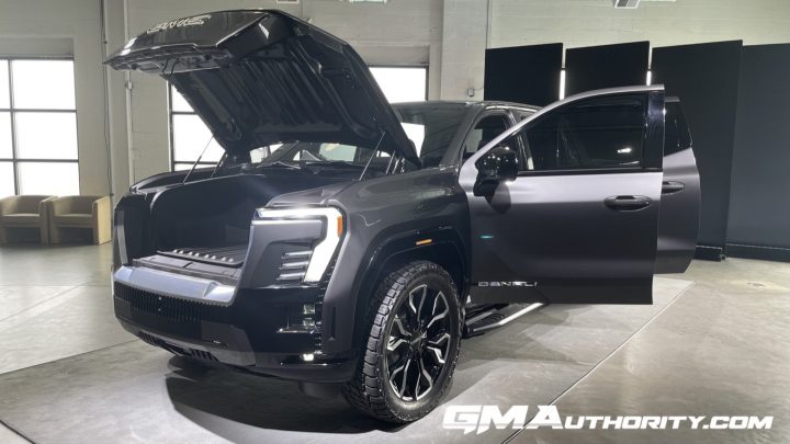 The 2024 GMC Sierra EV Denali Edition 1 with its doors and e-trunk opened.