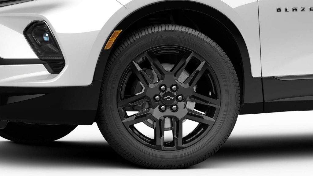 Close-up view of Gloss Black aluminum wheel on 2023 Chevy Blazer RS. 