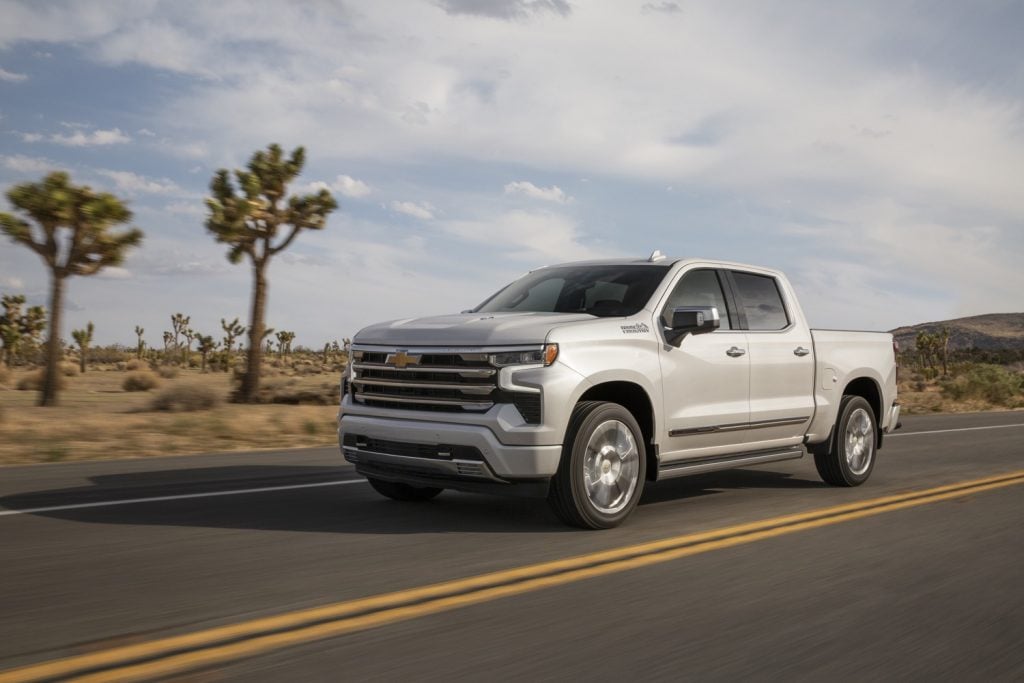 The front three-quarters view of the iconic 2022 Chevy Silverado in Iridescent Pearl Tricoat.