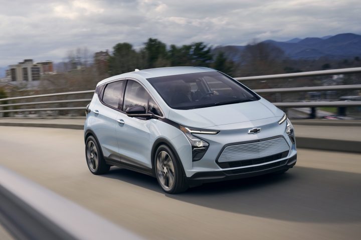 Chevy Bolt EV driving on a highway.