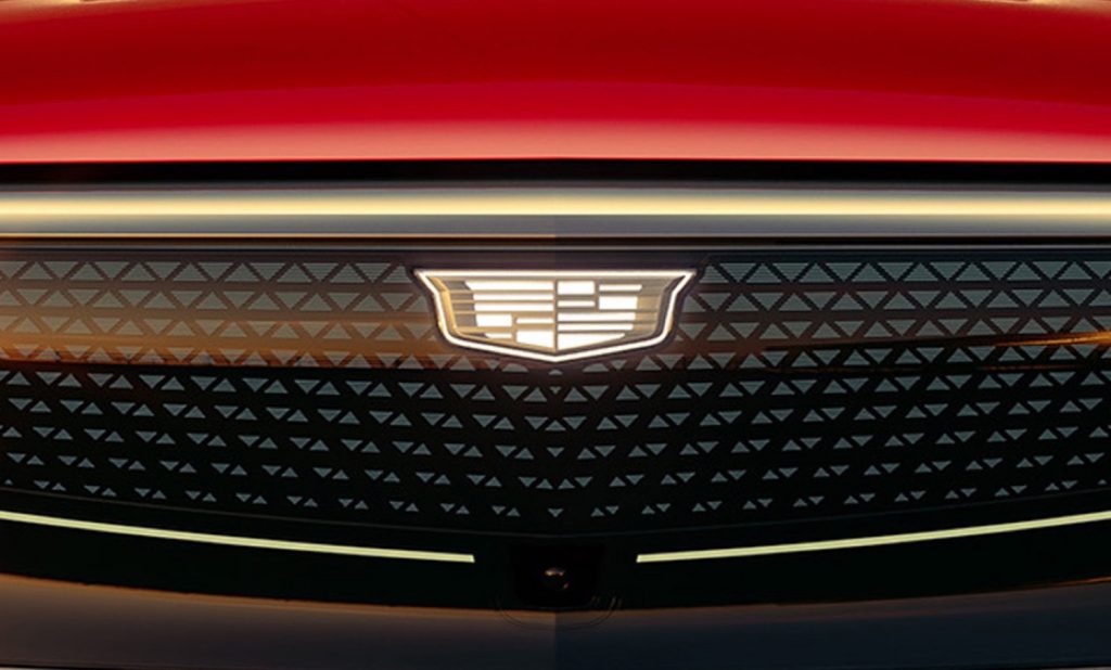 The Cadillac badge on the illuminated grille of a 2024 Cadillac Lyriq.