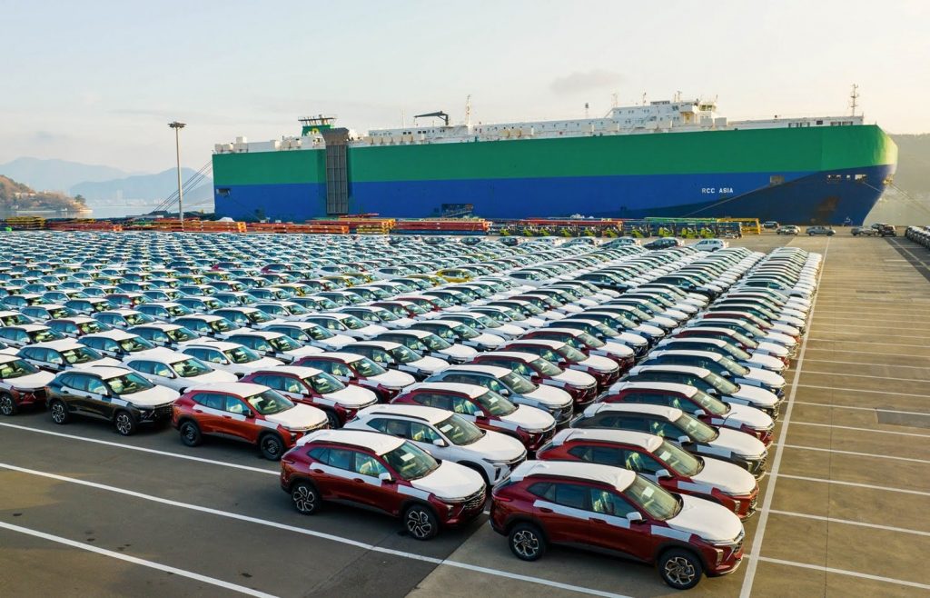 Large parking lot of new cars waiting for delivery and export, at