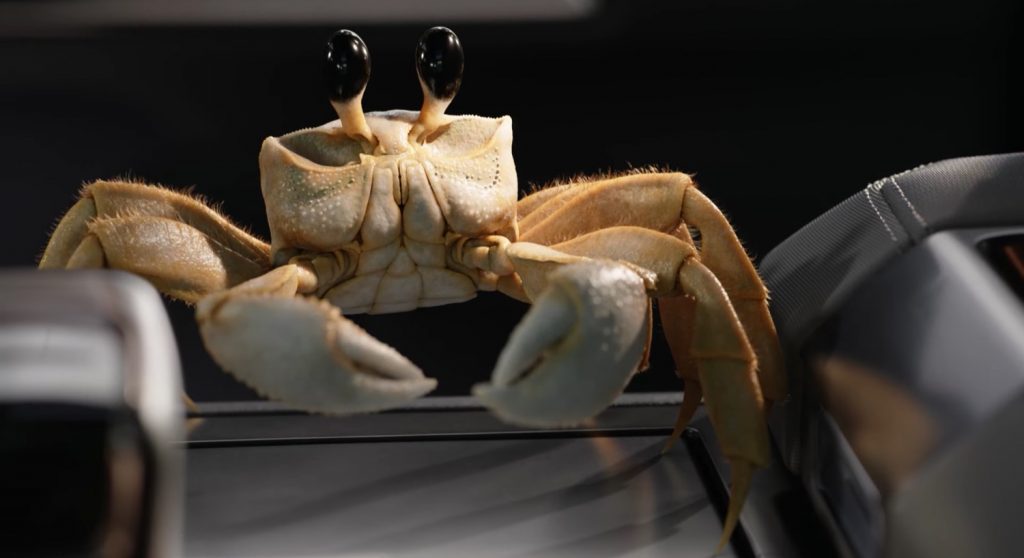 A screenshot showing a crab in a video advertisement for the GMC Hummer EV SUV.