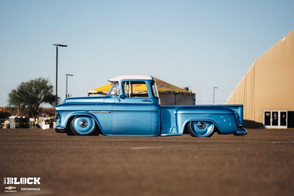 The side view of a custom 1955 Chevy 3100 restomod.