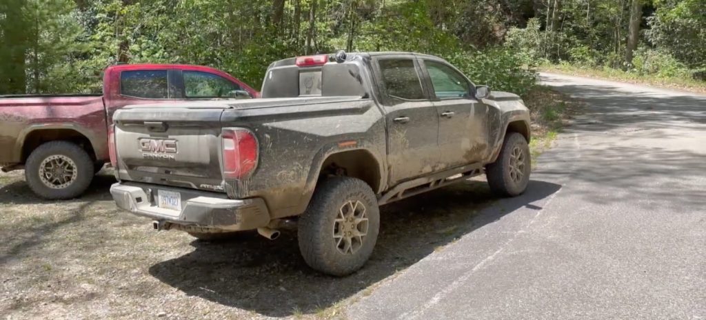 The 2023 GMC Canyon AT4X covered in mud after a stint off road.