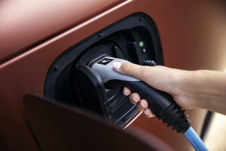 A Jaguar EV gets plugged in.