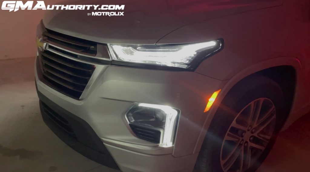 The front end of the 2022 Chevy Traverse with the daytime running lights illuminated.
