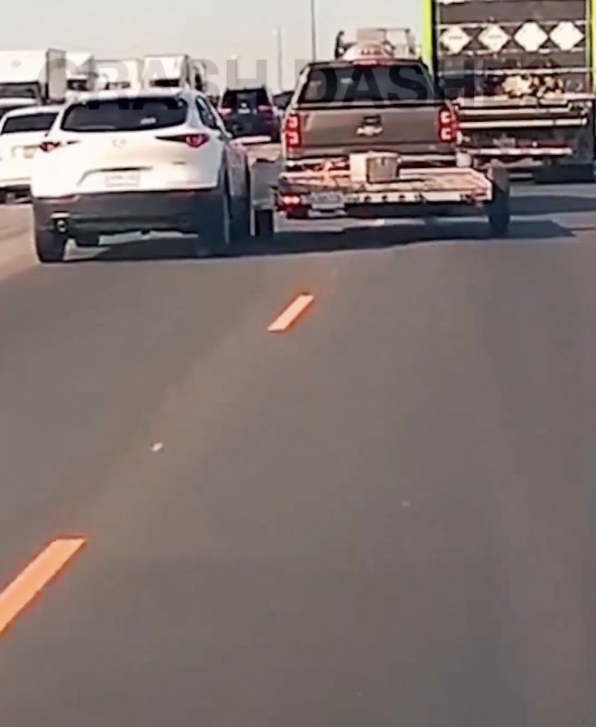 Photo of Chevy Silverado 1500 bumping into a Mazda crossover.
