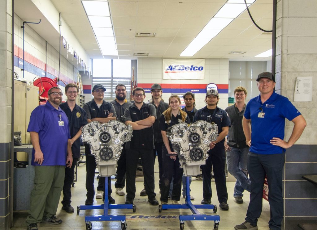 Technicians and students in the GM Automotive Service Educational Program.