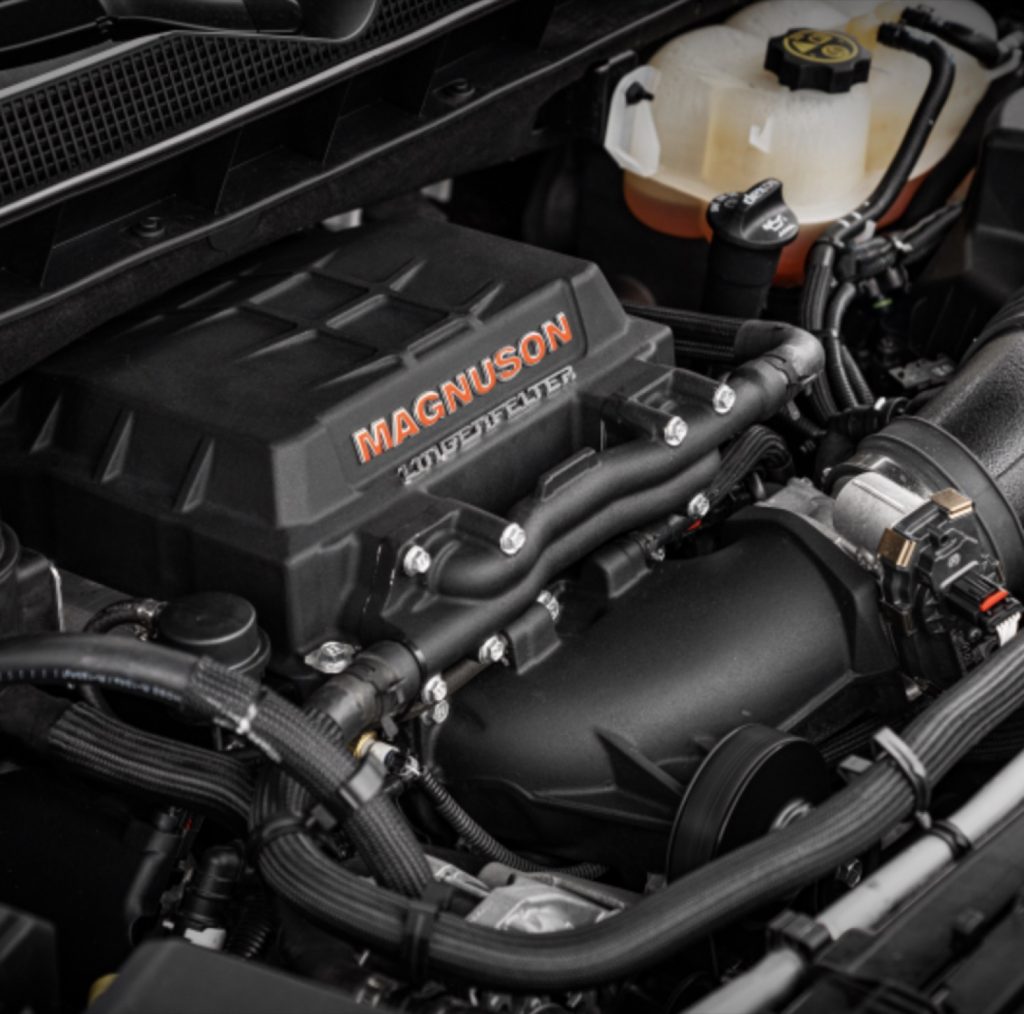 A photo of a GM SUV equipped with a Lingenfelter Magnuson supercharger.