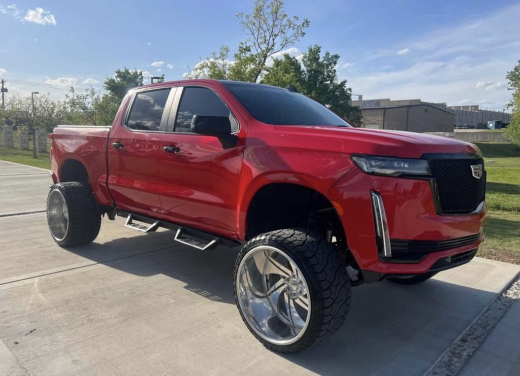 Front-three-quarter photo of 2021 Chevy Silverado LT Trail Boss with Cadillac Escalade front end.