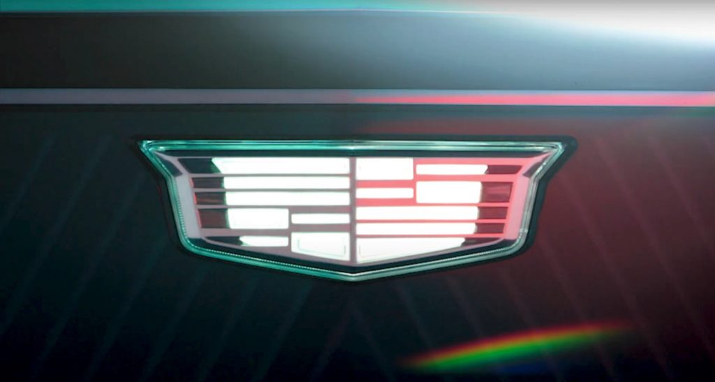 The badge of GM brand Cadillac on the Cadillac Escalade IQ teaser.