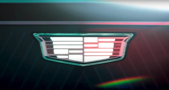 Illuminated Cadillac EV badge.