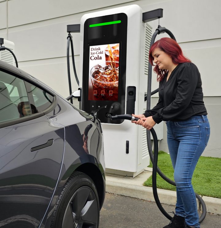 A driver using an EV charging station.