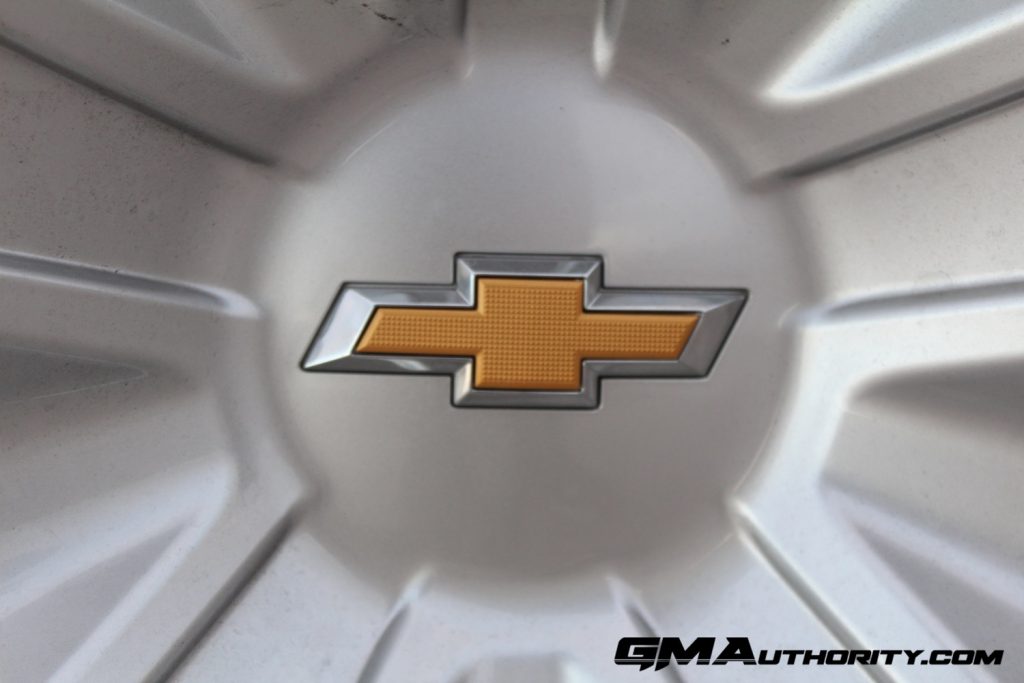 Photo of Chevy Bow Tie logo on the wheel of a Chevy Tahoe.
