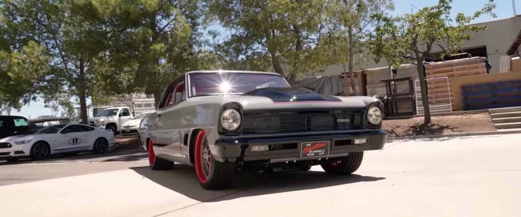 A custom 1966 Chevy II Nova parked in the sun.