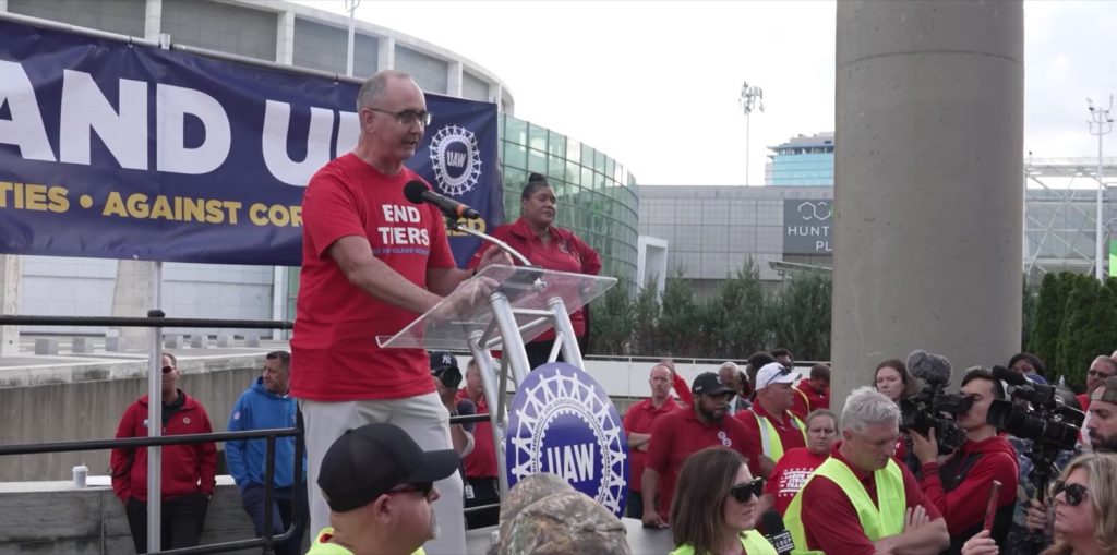 UAW President Shawn Fain addresses union members in a speech last month.