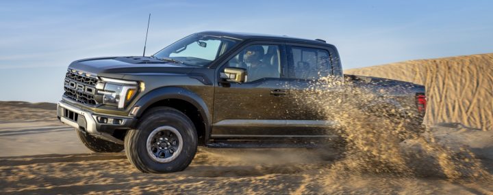 Ford F-150 Raptor driving off road.