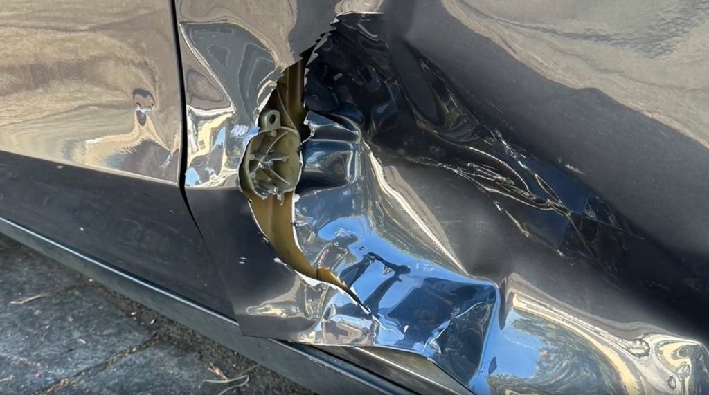 Damage to the Tesla Model Y from the hit-and-run Cadillac CTS.