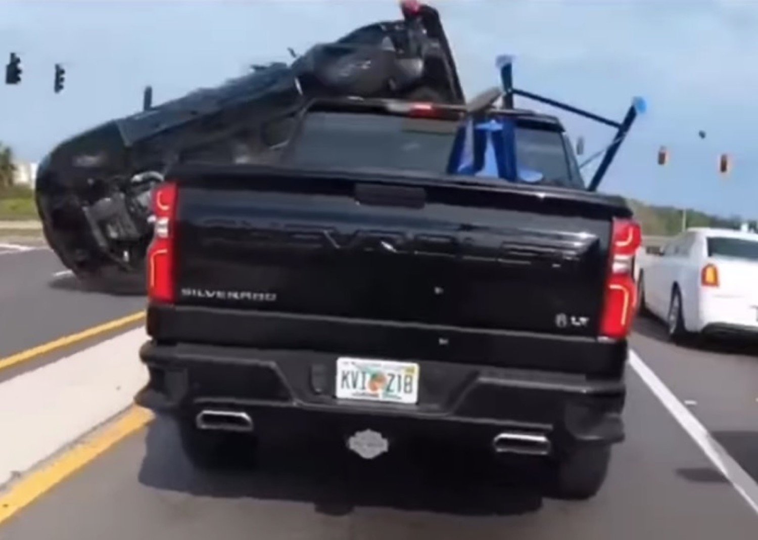 GMC Sierra Rolls, Smashes Chevy Silverado, Driver Unfazed