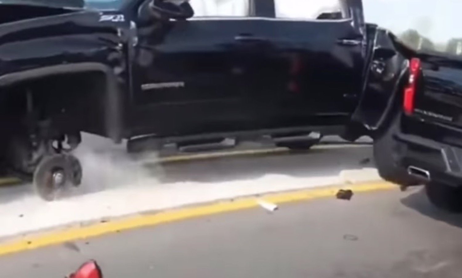 GMC Sierra Rolls, Smashes Chevy Silverado, Driver Unfazed