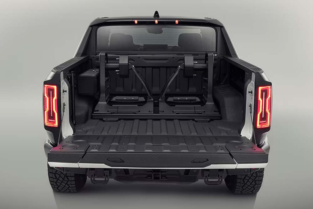 The Passenger side vertical tire carrier installed in the bed of the 2024 GMC Hummer EV Pickup.